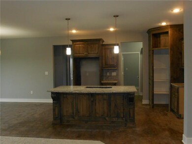 View of the kitchen. Stain cabinet Hardwood floors