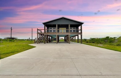 Coastal inspired home featuring a carport and con