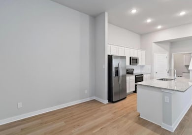 Kitchen featuring stainless steel appliances, a s