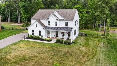 Modern inspired farmhouse with a front lawn and co