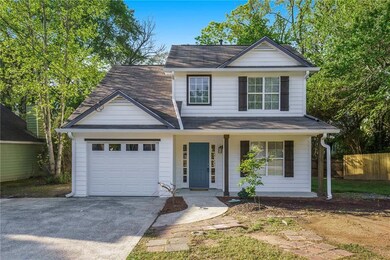 Traditional-style house with concrete driveway, an