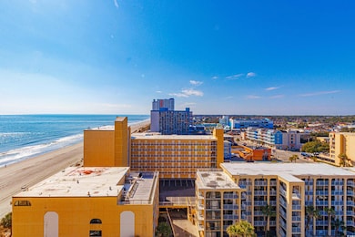 Property's view of city with a water view and a be