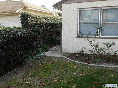Side Gated entrance. Great area for Trash cans or 