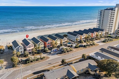 Drone / aerial view featuring a beach view and a w