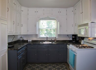 Lots of painted cabinets add to the farmhouse char