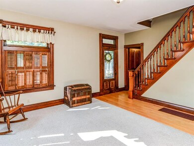 Entry with Original Restored Staircase and Woodwor