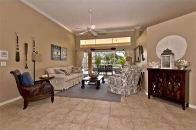 Foyer leads to the living room with views of lake 