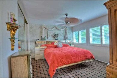 The master bedroom is bright and large, and featur