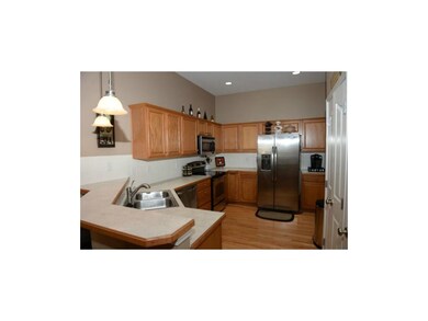 Kitchen with hardwood floor and stainless steal ap