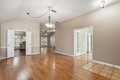 Open living area with vaulted ceiling
