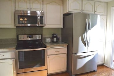 Kitchen with new stainless steel appliances, grani