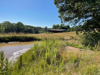 Pond and pole barn.