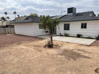 Rear view of house featuring a patio, central AC,