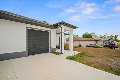 View of front of house featuring concrete driveway