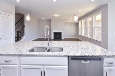 View from Kitchen into Great Room  (pictures are n