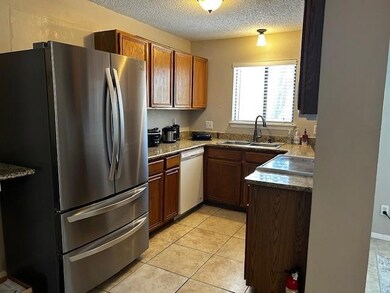Roomy kitchen with plenty of cabinets and work spa