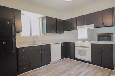 Kitchen featuring plenty of natural light, range h
