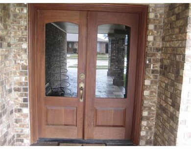 Photo. Double entry doors lead to a warm and invit