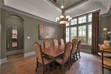 Formal dining room featuring elegant wood inset fl