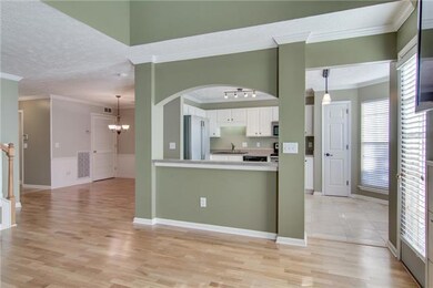 Breakfast bar separating the kitchen and living room gives an open feel.
