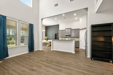 The open-concept design connects the living room t