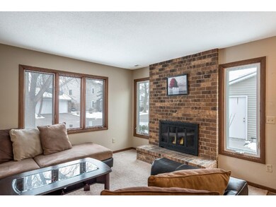 Warm living area with wood fireplace.