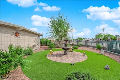 View of yard with fence and a gate