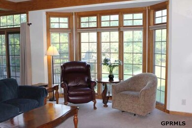 FR offers access to the deck & a great bay window for extra sitting area.  Built-in TV Shelving, Full wet bar (open to ofc as well), see thru Fireplace & plenty of room for everyone.