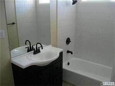 Bath w/ tile tub and designer sink and vanity
