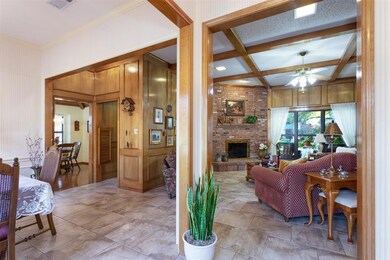 From entry looking toward living, formal dining and kitchen