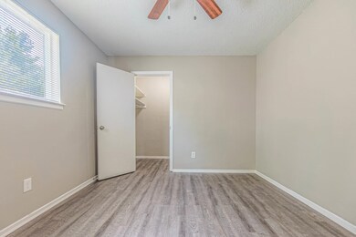 Unfurnished bedroom featuring ceiling fan, light h