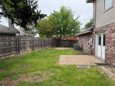 View of yard with central AC and a patio area