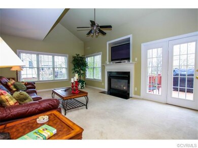Large family room with vaulted ceilings and entran