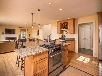 The kitchen features stainless steel...