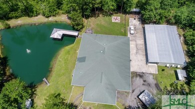 Main house next to the pond, covered gazebo over t