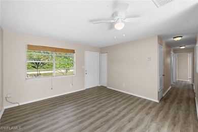 Livingroom featuring wood finished floors, ceiling