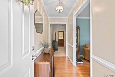 Welcome home! Hardwood floors and beautiful moldin