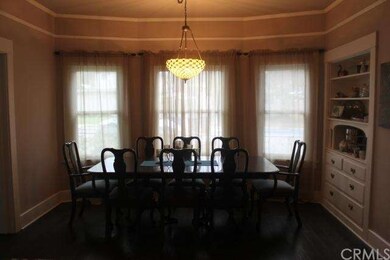 Dining Room with built in china cabinet and bay wi