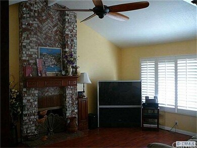 Spacious Living Room with  Cozy Fireplace and Soaring Ceilings.