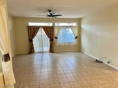 Spare room featuring light tile patterned floors,