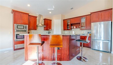 Upgraded wood cabinets with glass doors. Stainless