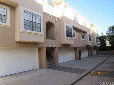2 Car Garage with a walk-in storage room and washe