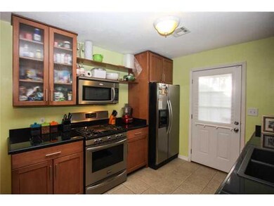 Kitchen. Remodeled kitchen! Gas stove 2 months old! The tile floors are porcelain tile not just ceramic. Black granite tiled countertops.
