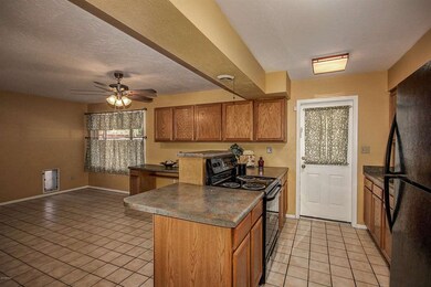 kitchen open to a tiled area