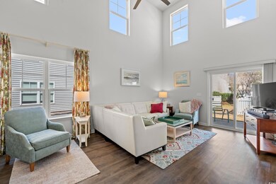 Living room featuring a wealth of natural light, w