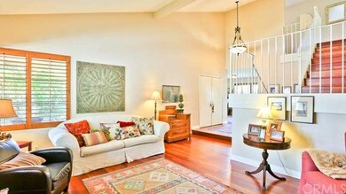 Living room view and double door entry into the ho