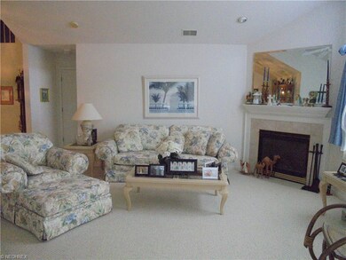Living room with gas log fireplace.