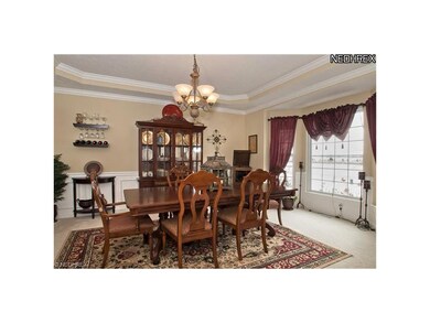 Formal dining room with wainscoatting, tray ceilin