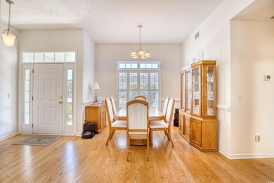 Dining space with light wood-style floors, a notab