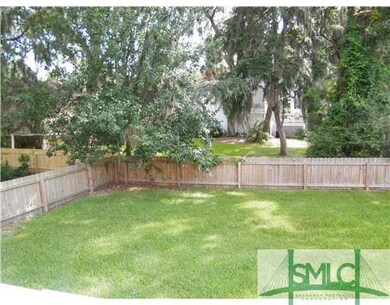 Exterior Back. Very large fenced backyard